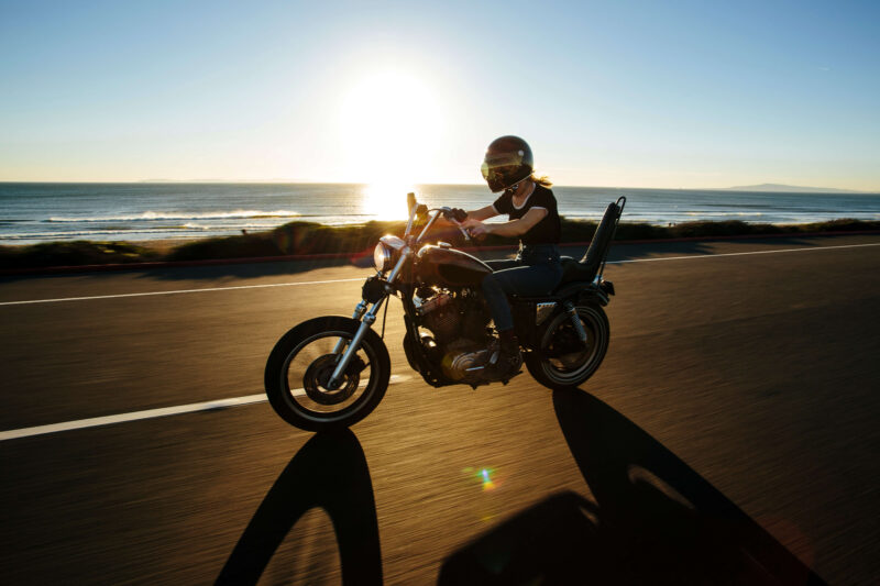 Riding a motorcycle oceanside