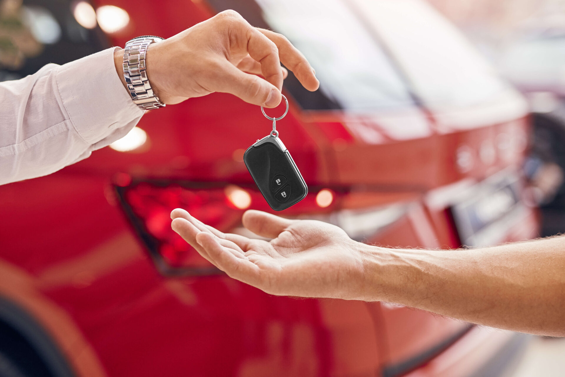 handing over the keys to a car
