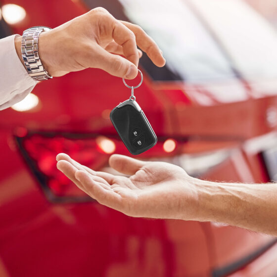 handing over the keys to a car