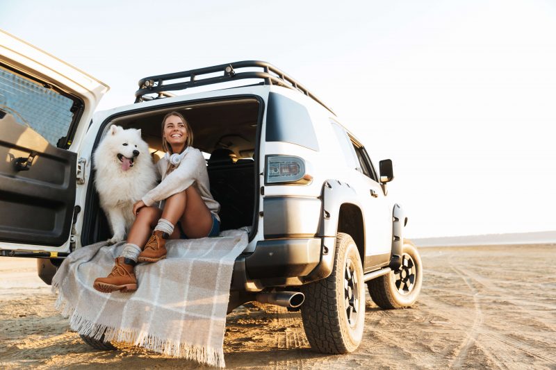 Gal with her pup on the beach