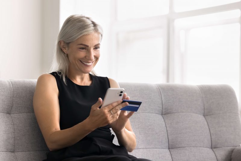 Woman paying online with a credit card