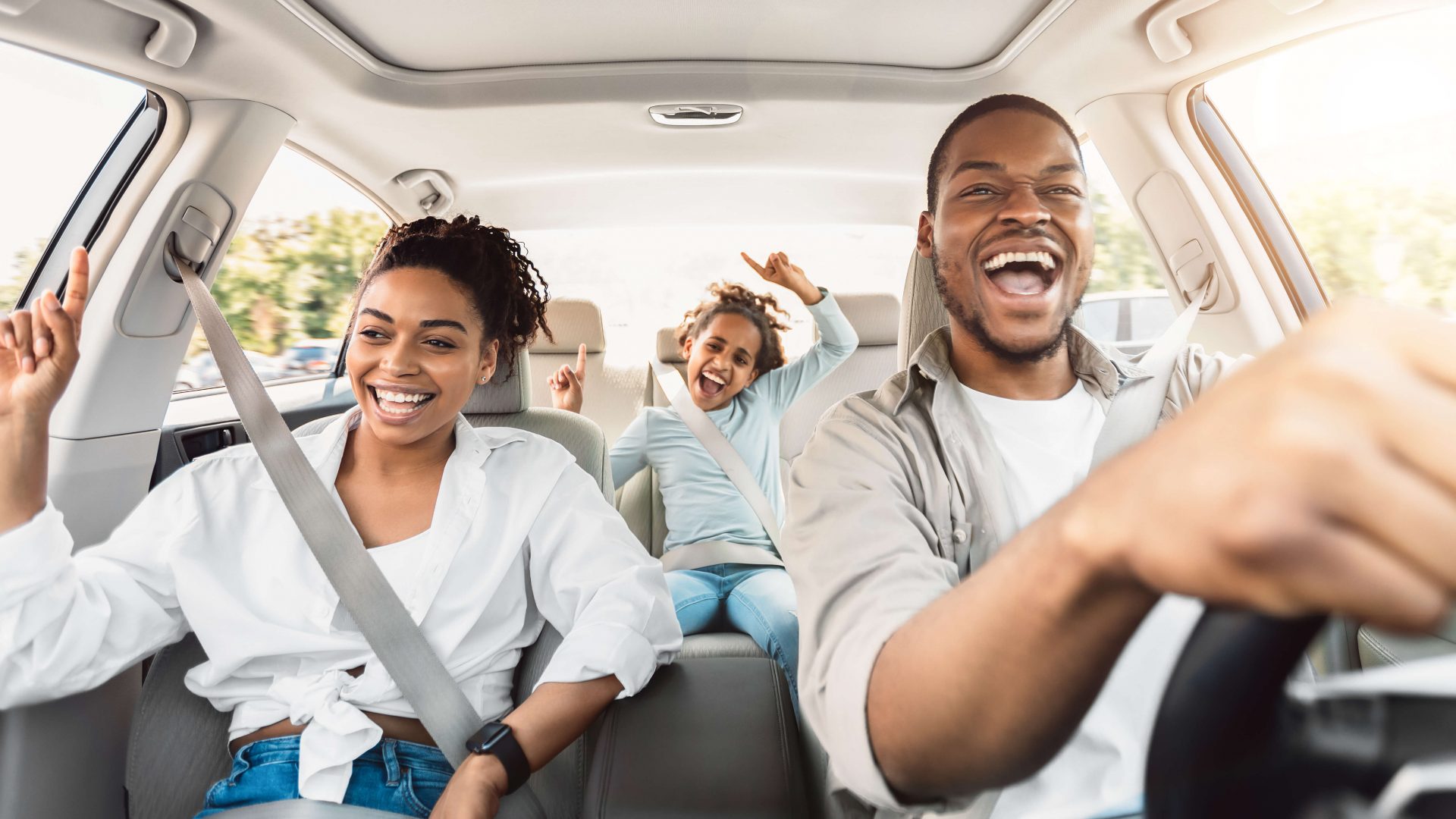 Happy family in a car