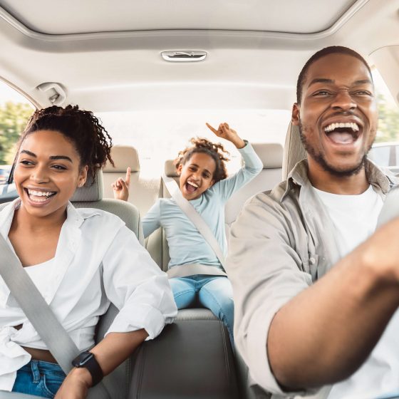 Happy family in a car