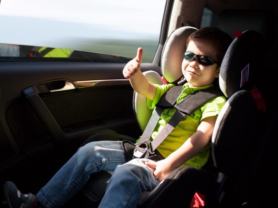 Little boy in car sear
