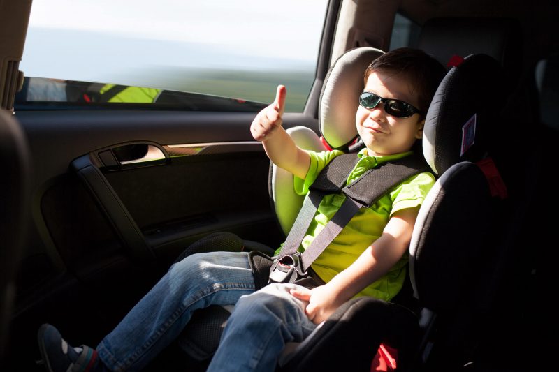 Little boy in car sear