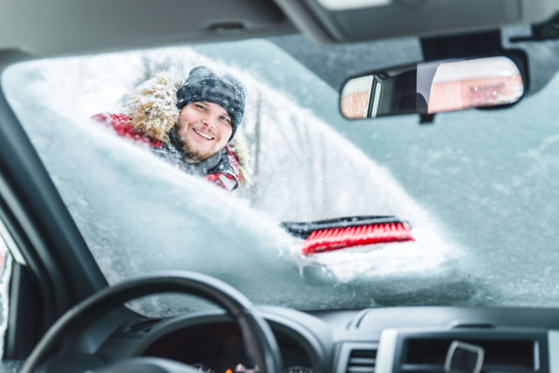 Clearing snow off windshield