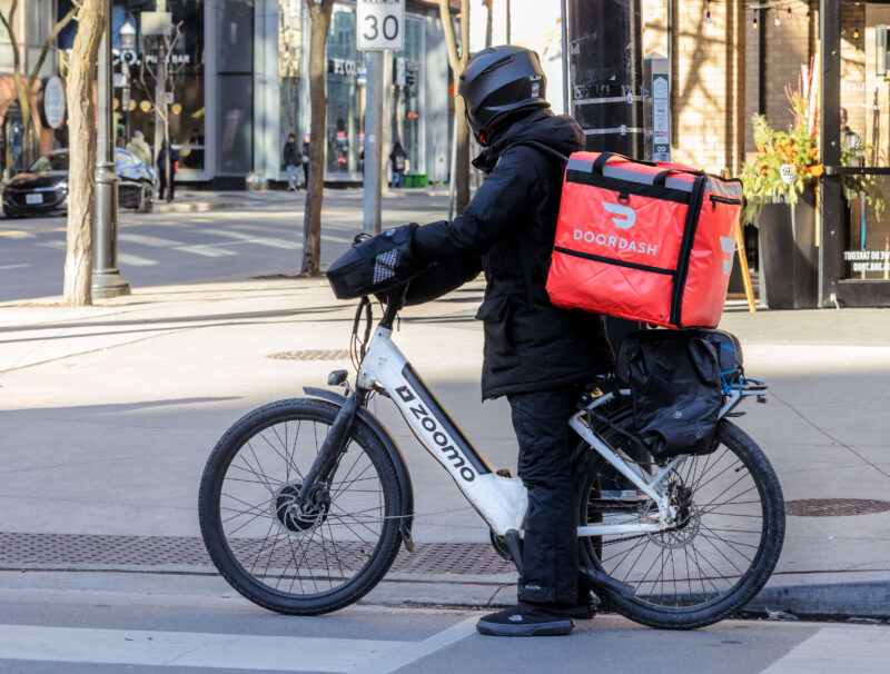 DoorDash driver on a bicycle