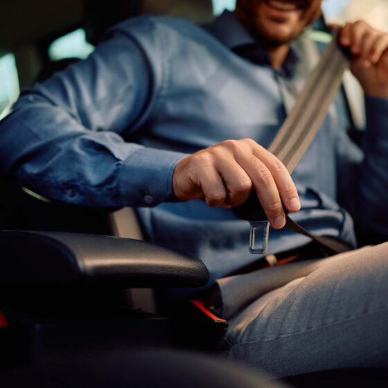 Putting on a seatbelt