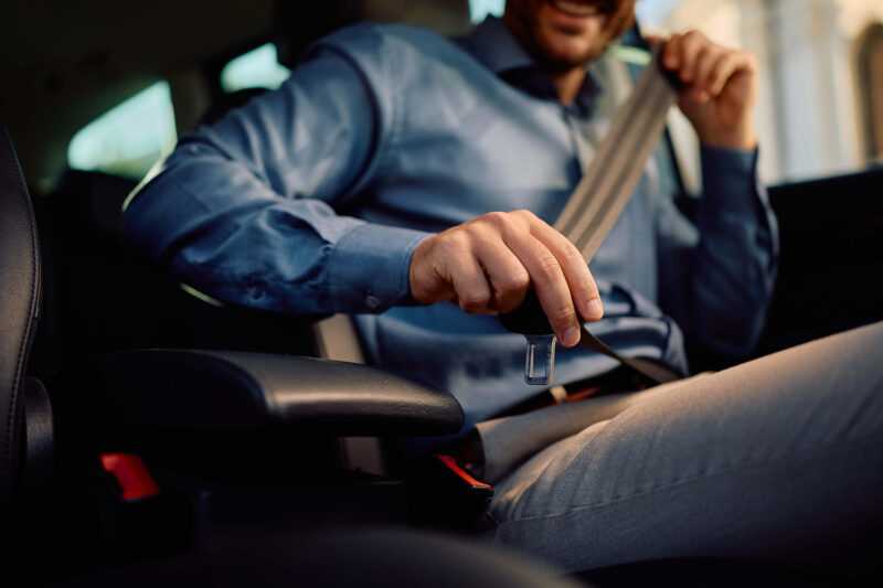 Putting on a seatbelt