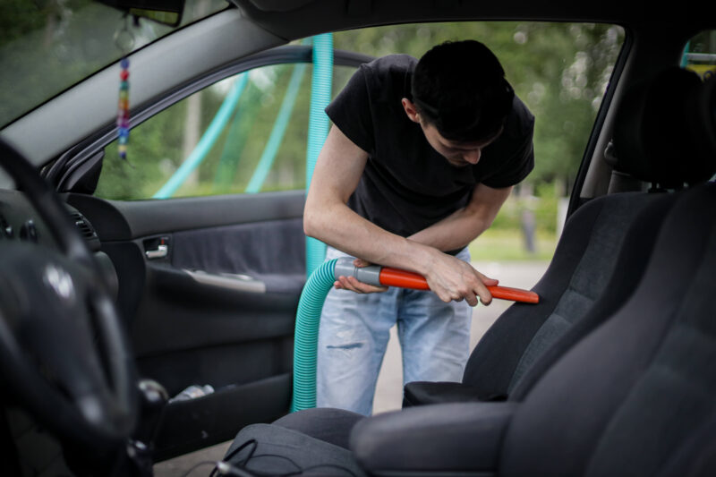 Vacuuming interior of car